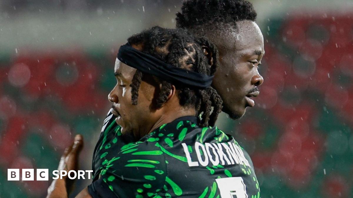 Semi Ajayi, wearing an all-green Nigeria kit, peels away in celebration after scoring for Nigeria. He is followed by team-mate Akor Adams, with Bright Osayi-Samuel trailing further behind