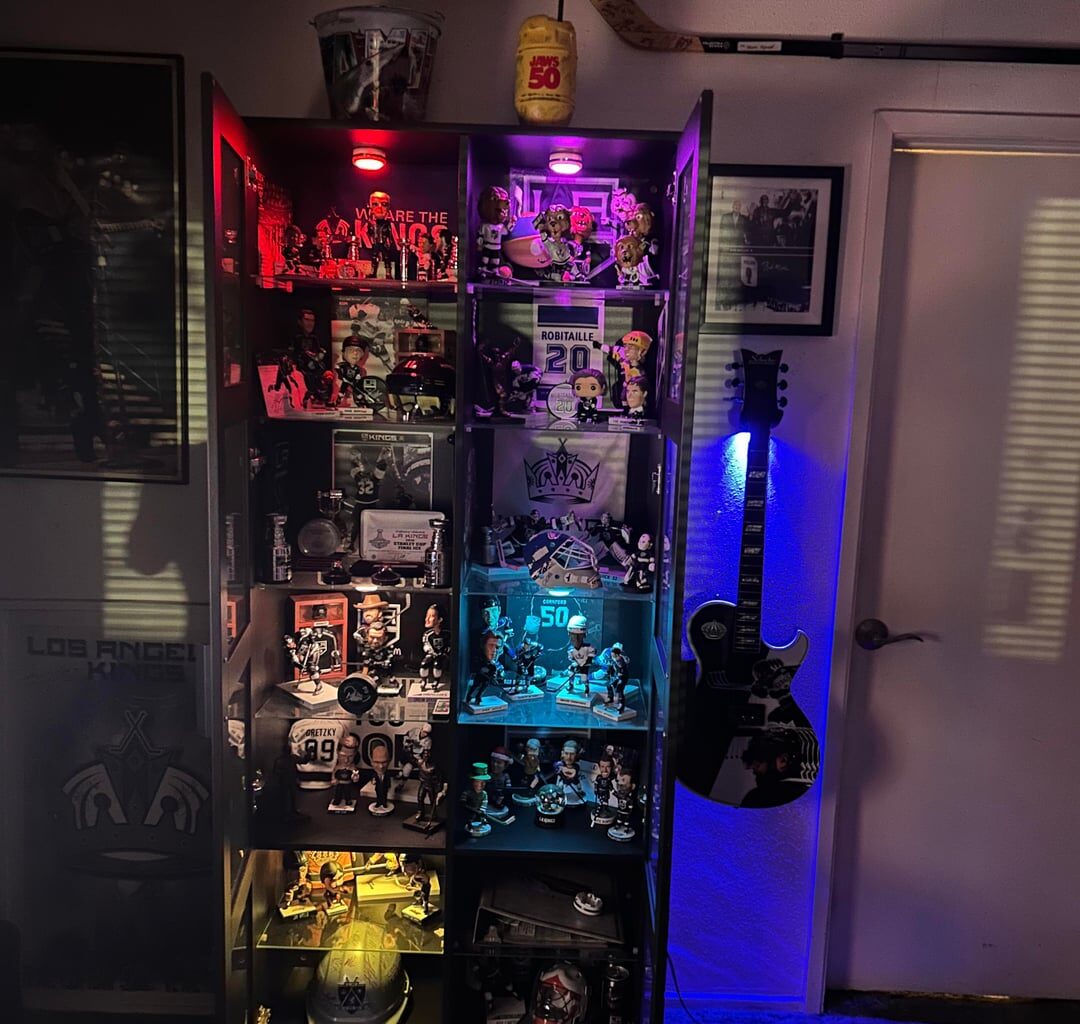 I just got my guitar for being a season ticket holder for 26 years.  And it hanging on the wall now.  Pretty cool holder with different colors.