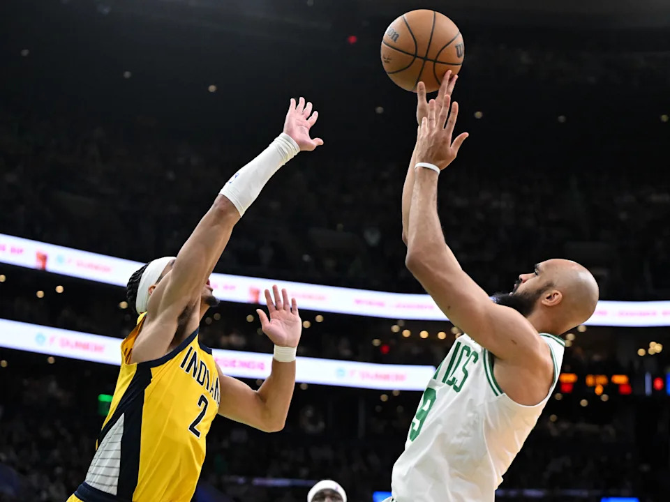 BOSTON, MASSACHUSETTS - DECEMBER 29: Derrick White #9 of the Boston Celtics puts up a shot against Andrew Nembhard #2 of the Indiana Pacers during the second quarter at the TD Garden on December 29, 2024 in Boston, Massachusetts. NOTE TO USER: User expressly acknowledges and agrees that, by downloading and or using this photograph, User is consenting to the terms and conditions of the Getty Images License Agreement. (Photo by Brian Fluharty/Getty Images)
