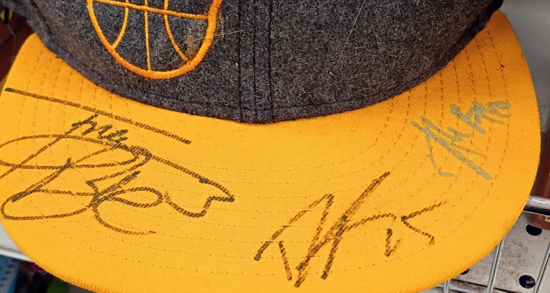 Who signed this hat?