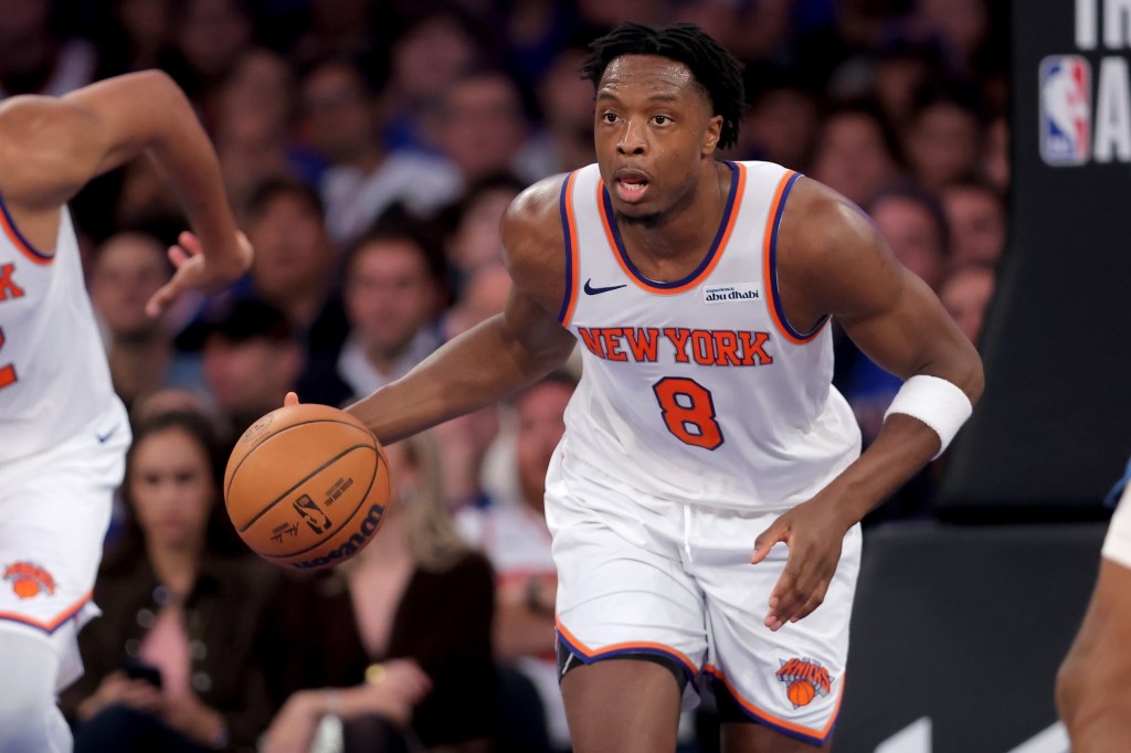 New York Knicks forward OG Anunoby (8) brings the ball up court against the Minnesota Timberwolves.