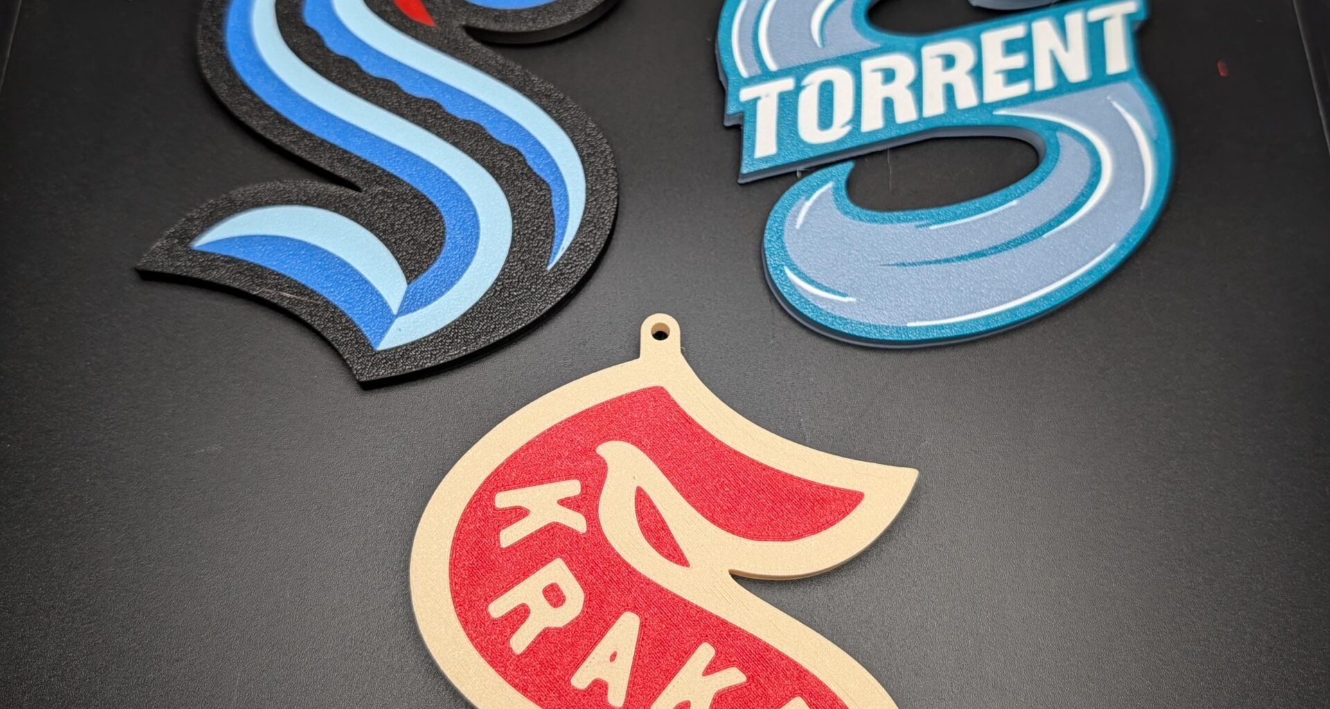 It was brought to my attention that I need to make more ornaments, but I couldn't decide which version of Kraken logos I wanted, so I made both. Also someone mentioned a Torrent ornament. What do you guys think?