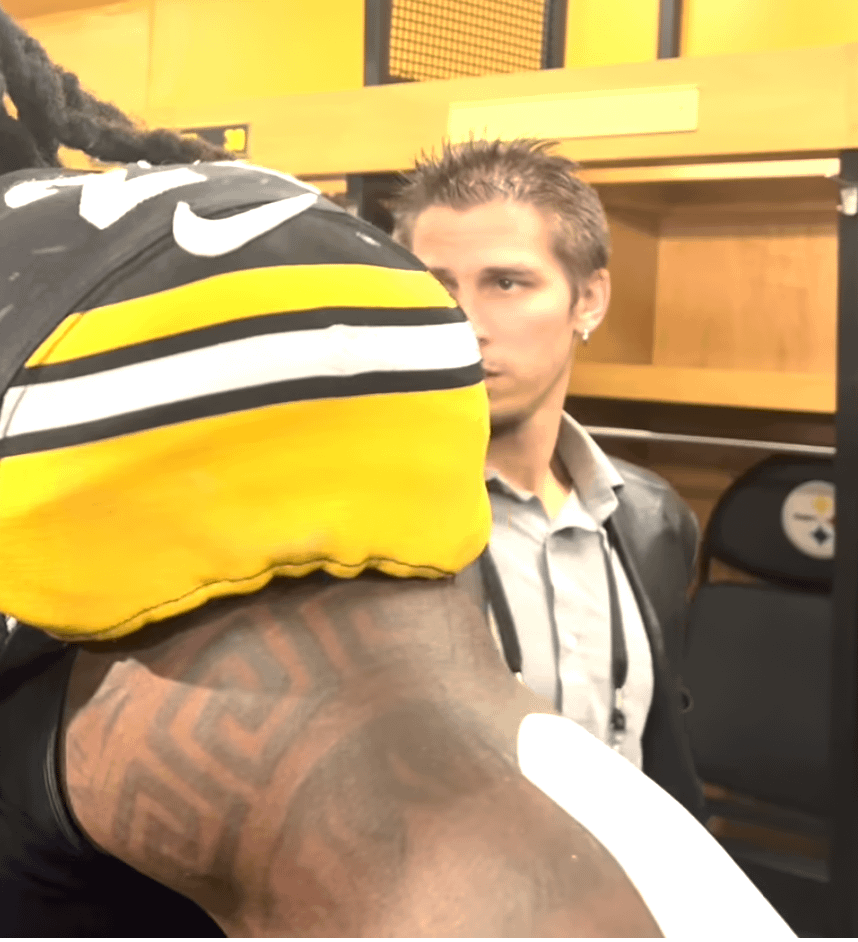 Who is this guy always lurking behind players?