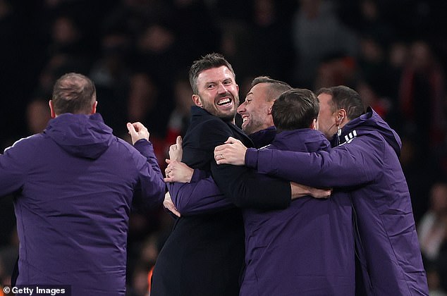 Carrick wildly celebrated United's goals with his purple-clad backroom staff