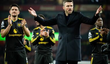 Michael Carrick celebrates in front of the Man United fans - and his children - at Arsenal