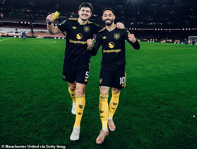 Harry Maguire and match-winner Matheus Cunha leave the Emirates Stadium pitch