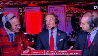 A flannel with a shirt and tie. Never change, Mickey!