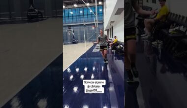 Caitlin Clark throwing football around at Indiana Pacers training facility
