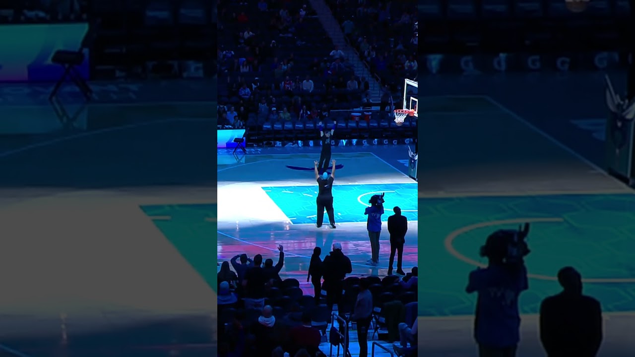 Hornets fan sinks a half court shot and then shows off his Dell Curry jersey!