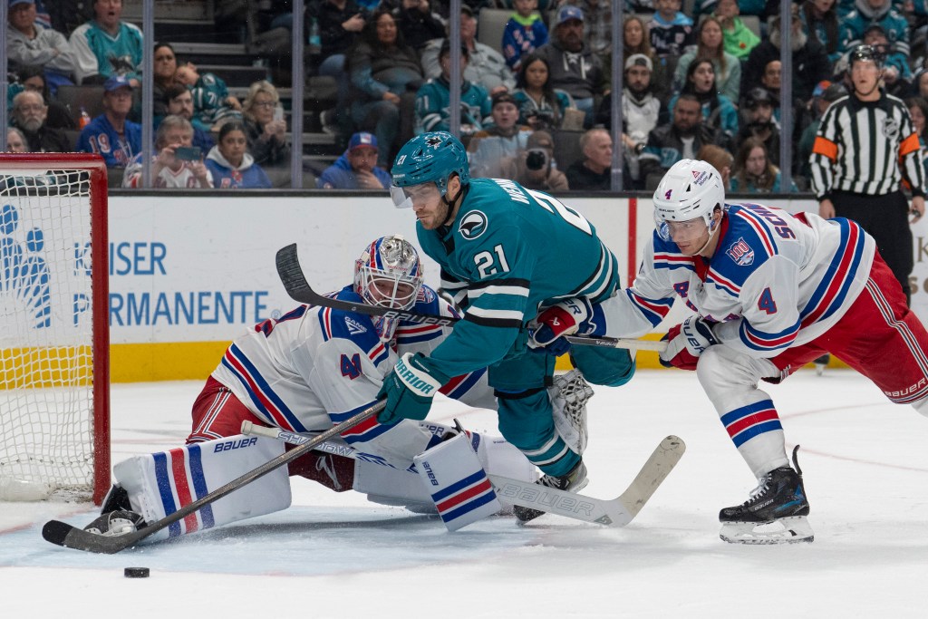 San Jose Sharks center Alexander Wennberg (21) attempts to shoot past New York Rangers goaltender Spencer Martin (41) during the second period at SAP Center at San Jose. 