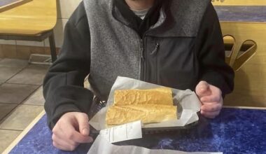 Quinn Hughes enjoying a sandwich before the game