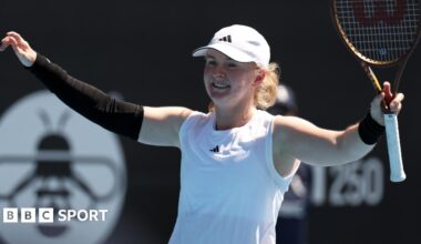 Francesca Jones raises her arms in celebration after victory at the Auckland Classic