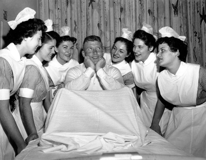 Mickey Mantle is the center of attraction before undergoing a tonsillectomy at Lenox Hill Hospital on January 17, 1956