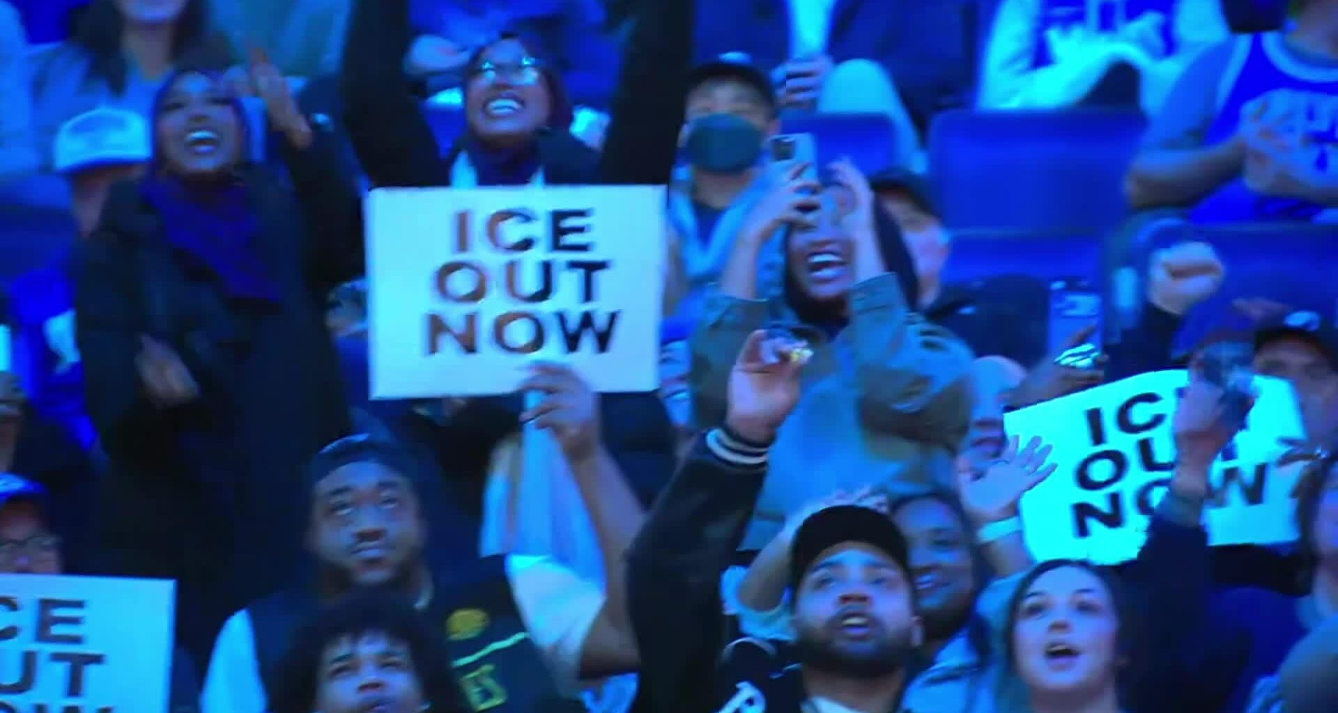 Timberwolves fans receive cheers from the local crowd when they show their "ICE OUT NOW" signs (seen on the jumbotron)