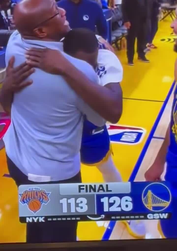 Mike Brown hugging Draymond post game