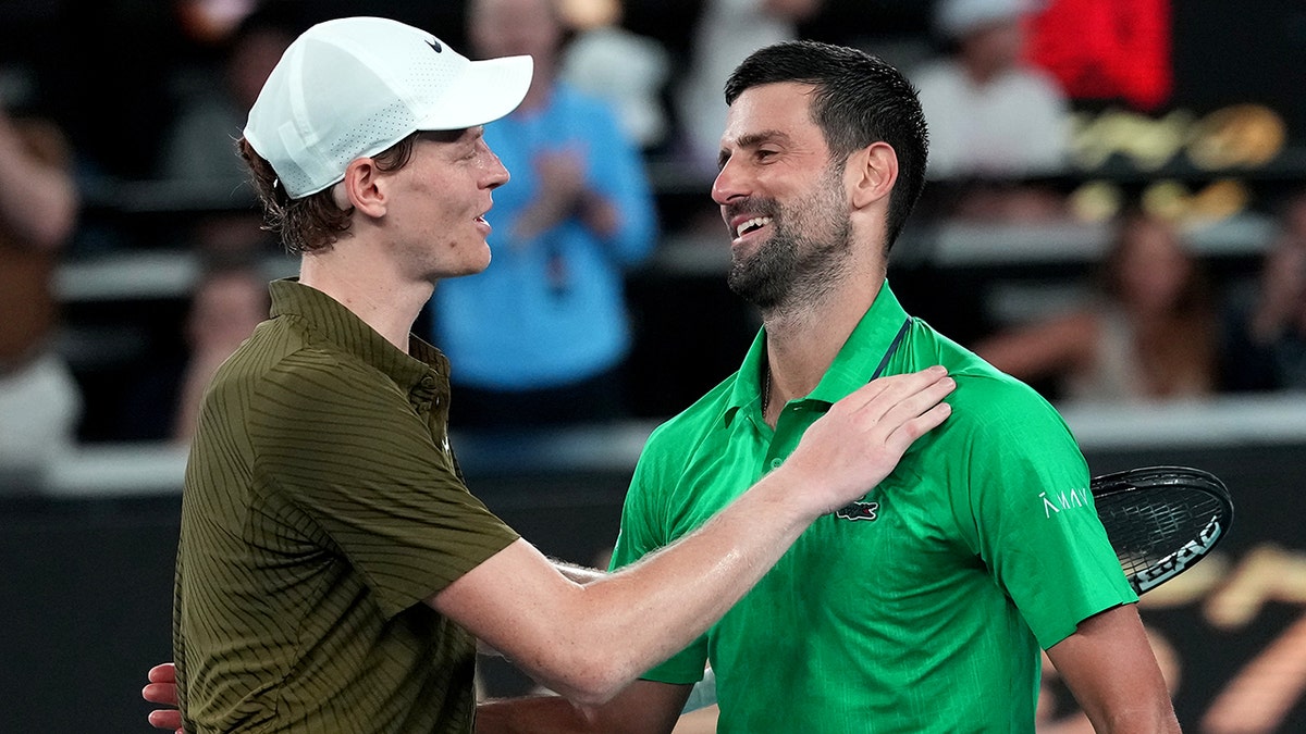 Novak Djokovic congratulated by Jannik Sinner