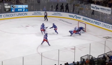 Quick lifts Carcone's skate after Carcone scores and runs into him