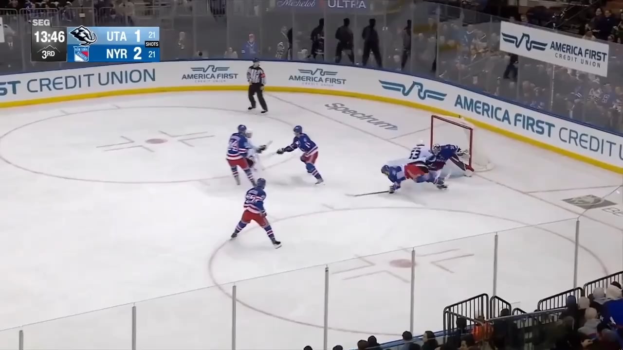 Quick lifts Carcone's skate after Carcone scores and runs into him