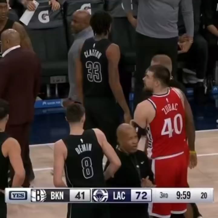John Collins pushes Egor Dëmin after he tries to pick up James Harden after a foul. Terance Mann intervenes.