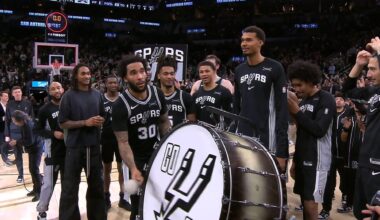 Julian Champagnie is grabbed from his jersey, taken by BIsmack Biyombo to do the new Spurs tradition with the drum, after scoring a career-high 11 threes, setting also a franchise record