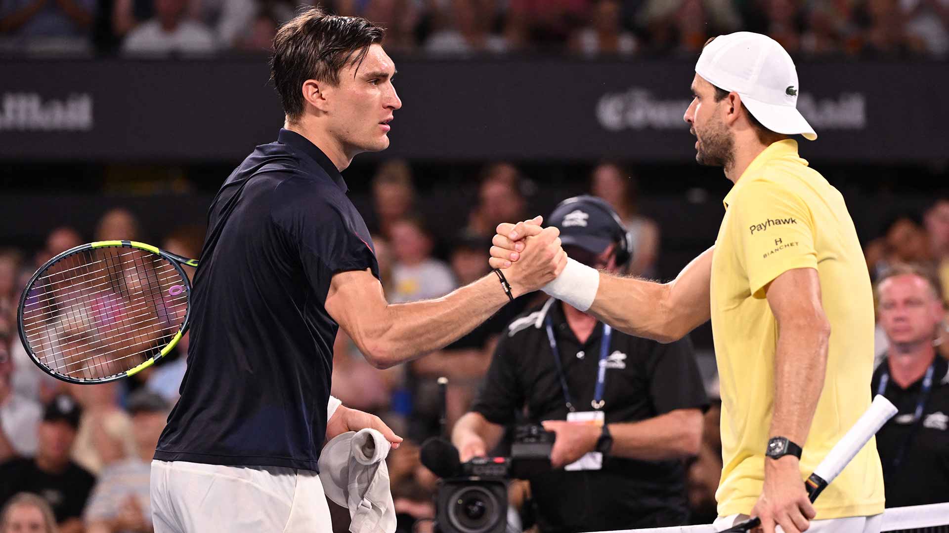 Raphael Collignon and Grigor Dimitrov at the net following their first Lexus ATP Head2Head meeting.