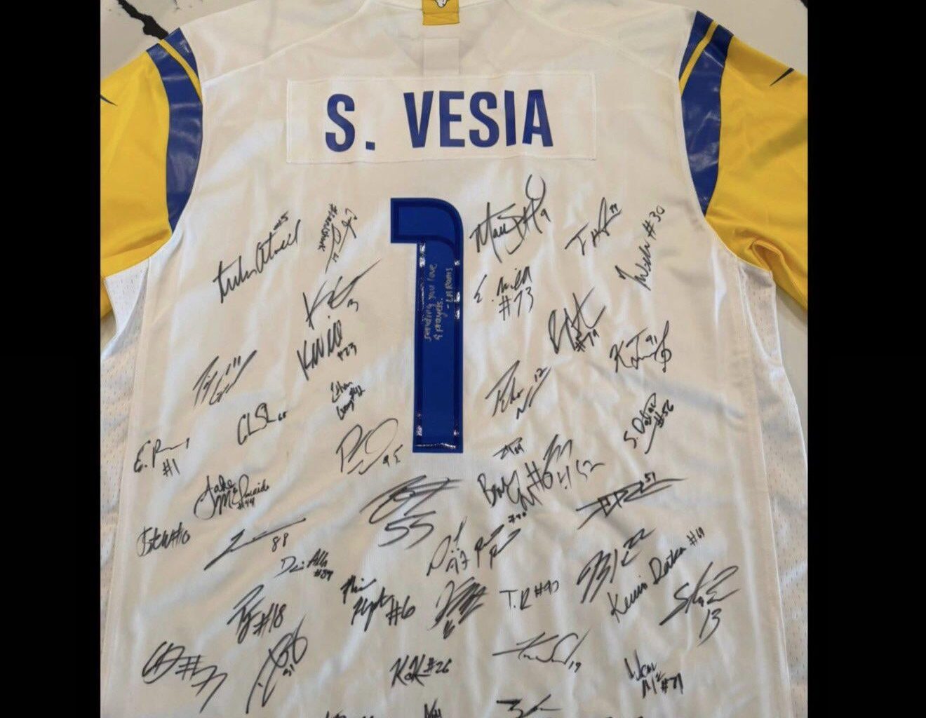 The Rams gifted a signed jersey to Dodgers reliever Alex Vesia