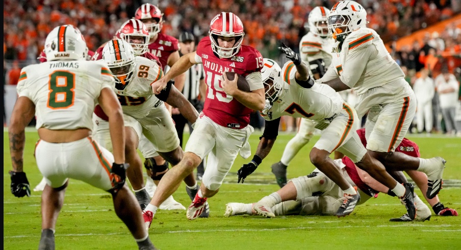 Indiana quarterback Fernando Mendoza (15) rushes into the end zone for a touchdown against Miami during the College Football Playoff national championship game at Hard Rock Stadium in Miami Gardens, Fla., on Jan. 19, 2026.