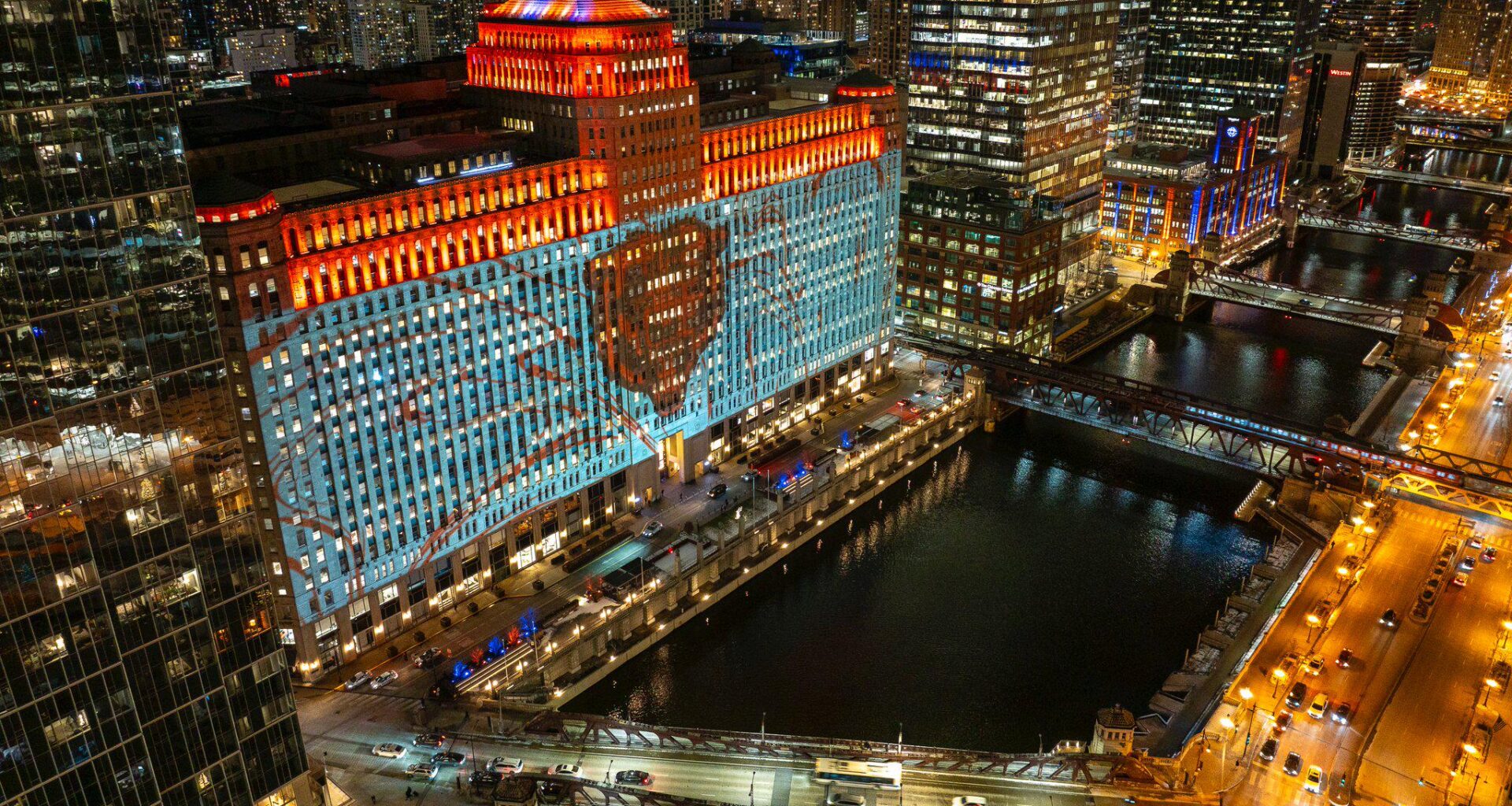 [Tyler Pasciak LaRiviere/Sun-Times] The Chicago Bears logo illuminates the Merchandise Mart, Thursday, Jan. 15, 2026.