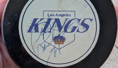 Found this autographed puck from the 90s while cleaning out my garage. Any idea whose autograph it is?