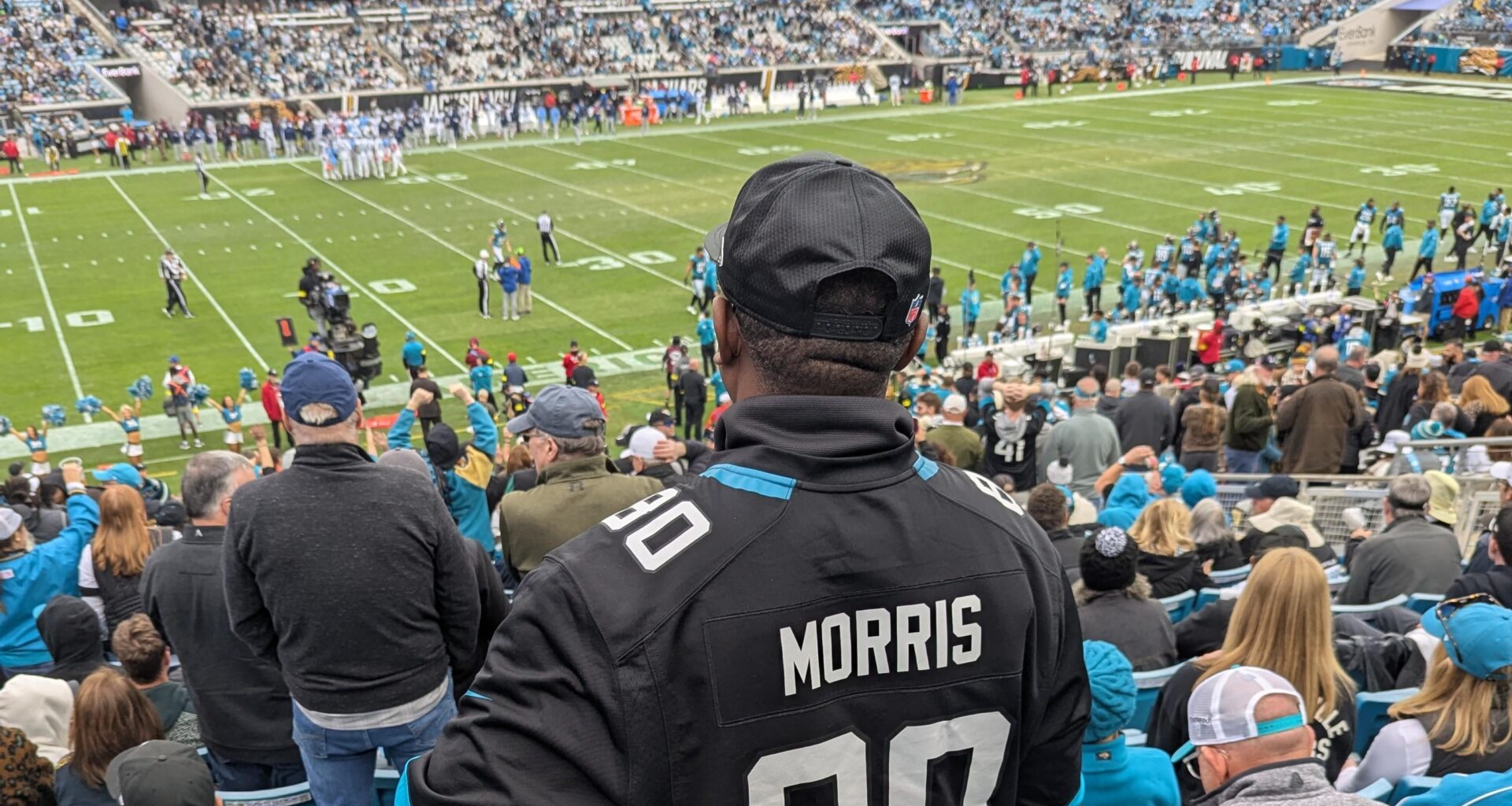 Quintin Morris's dad holding the game ball from his son's TD catch, also TLaw's 38th TD of the season making him the franchise's single-season leader in total TDs