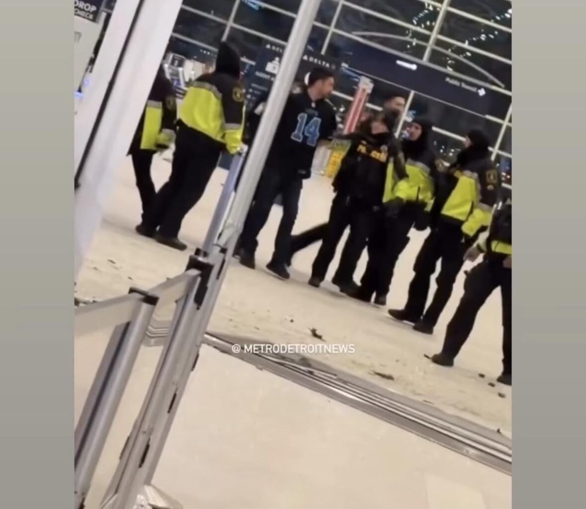 Amon-Ra St. Brown reaction to someone crashing into the McNamara terminal at Detroit Metro Airport wearing his jersey