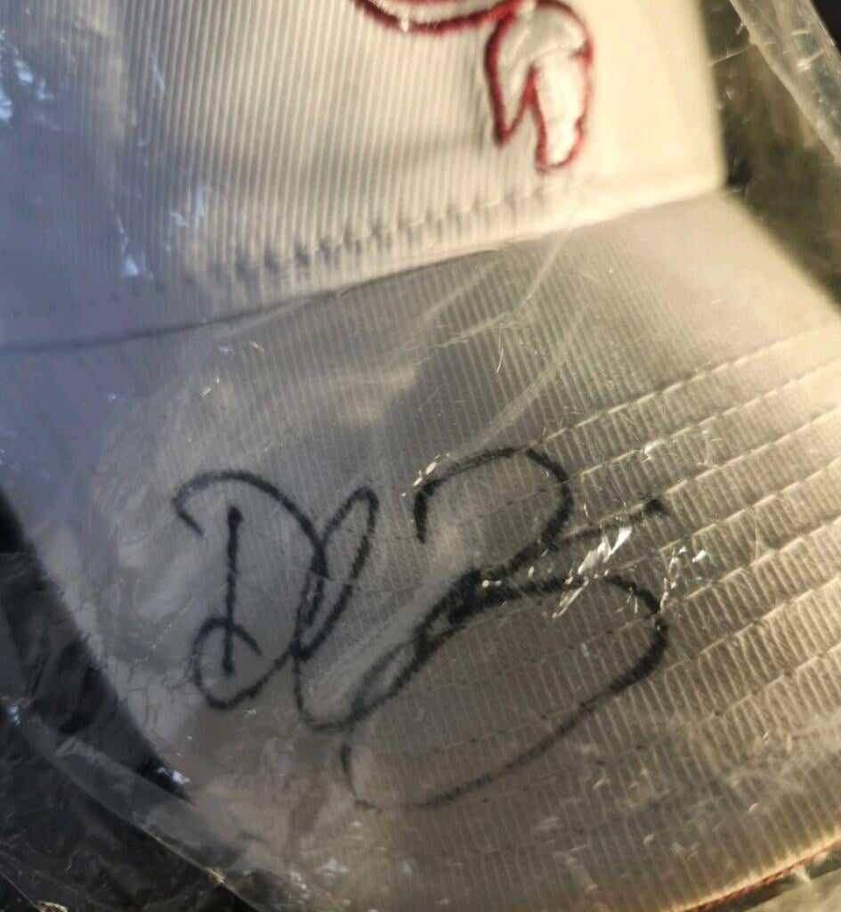 Coworker has a brother who bought a hat "from the Championship years". Anyone recognize the signature?