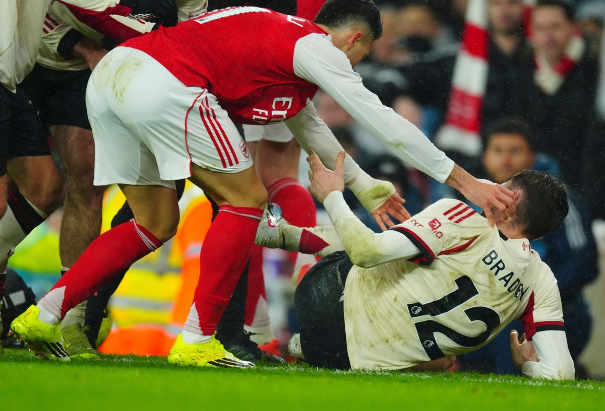 Gabriel Martinelli of Arsenal tries to shove Conor Bradley of Liverpool off the pitch after he appeared to have suffered a serious injury