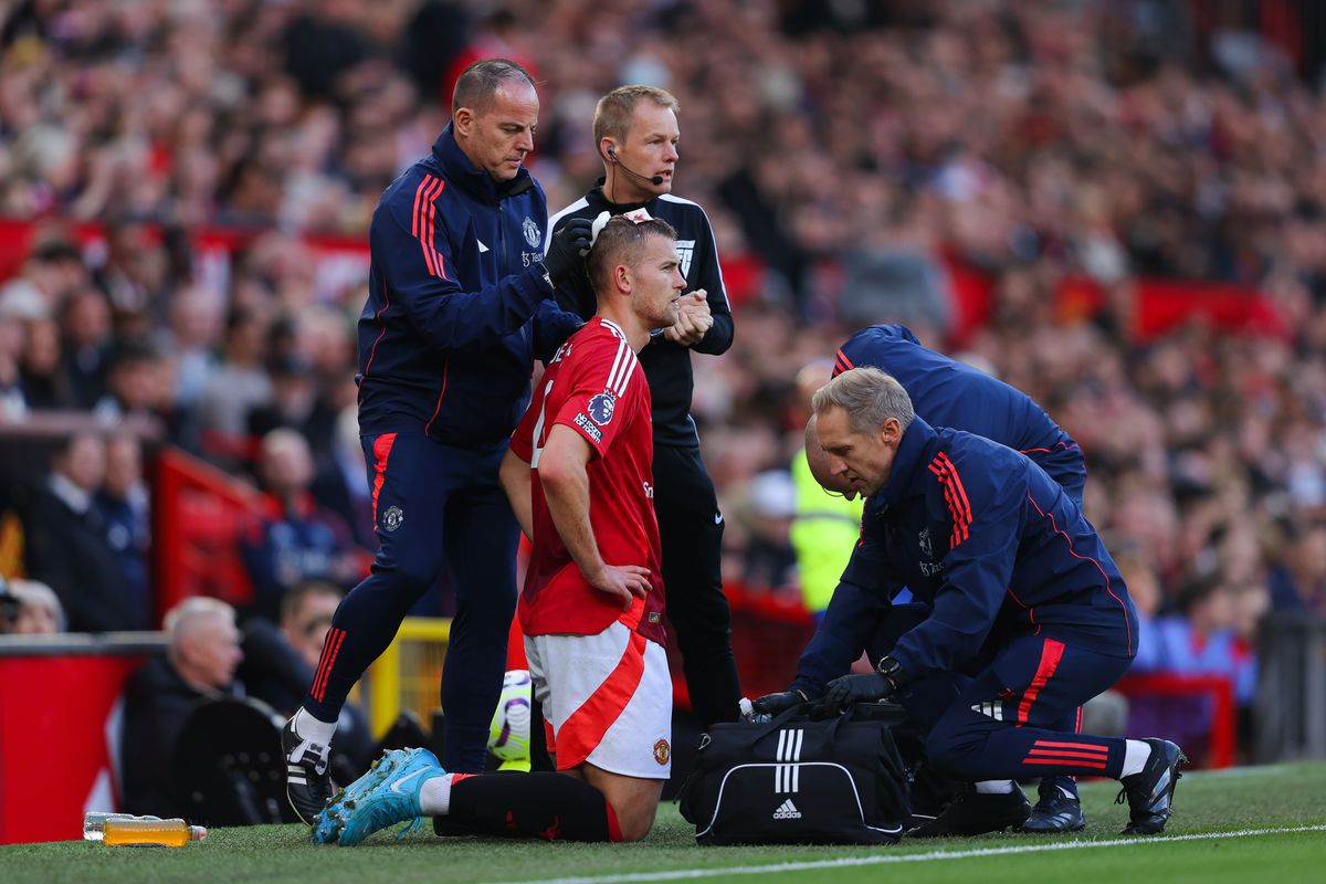 Matthijs de Ligt of Manchester United receives treatment for a head injury 