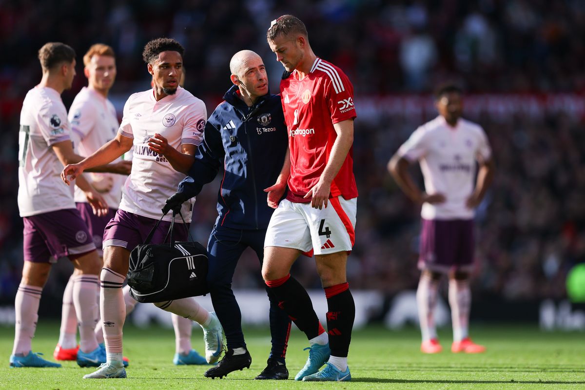  Matthijs de Ligt of Manchester United receives treatment for a head injury during the Premier League match between Manchester United FC and Brentford FC