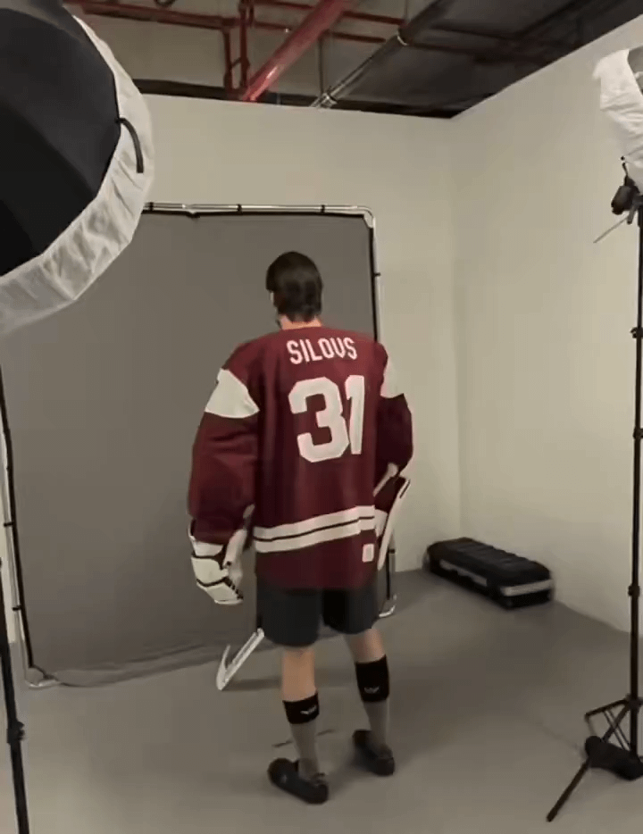 A half dressed Artūrs Šilovs poses for photos