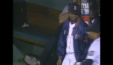 Nomar Garciaparra and Mark Portugal use tape to tie Pedro Martinez to a pole in the dugout at Fenway Park
