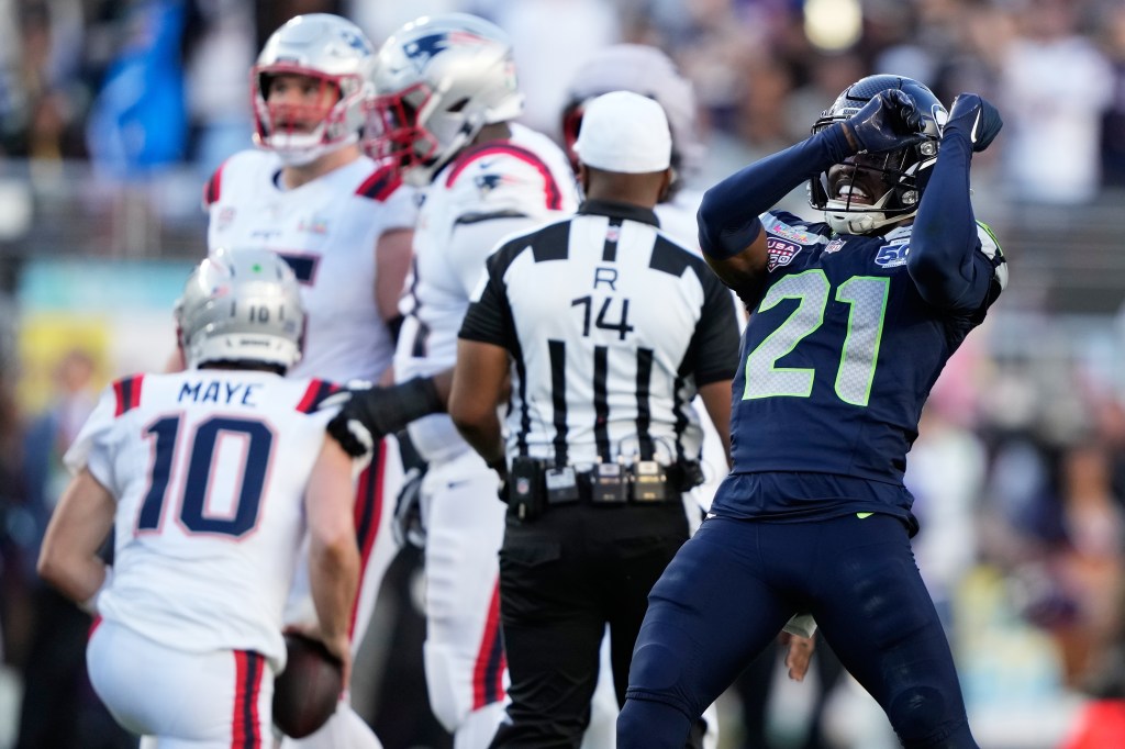 Devon Witherspoon celebrating after sacking Drake Maye.