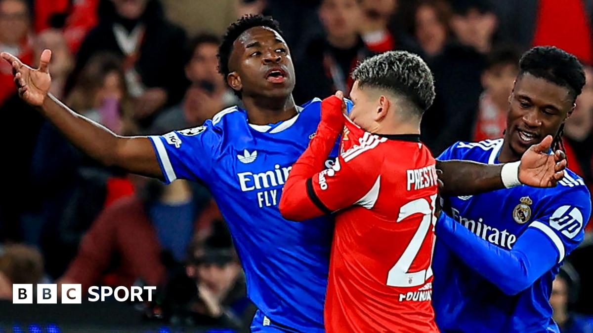 Real Madrid's Vinicius Junior reacts after an interaction with Benfica's Gianluca Prestianni