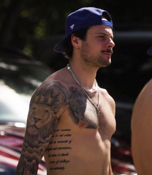 Chest tattoo says “The ultimate measure of a man is not where he stands in moments of comfort and convenience, but where he stands at times of challenge and controversy.” - Martin Luther King Jr