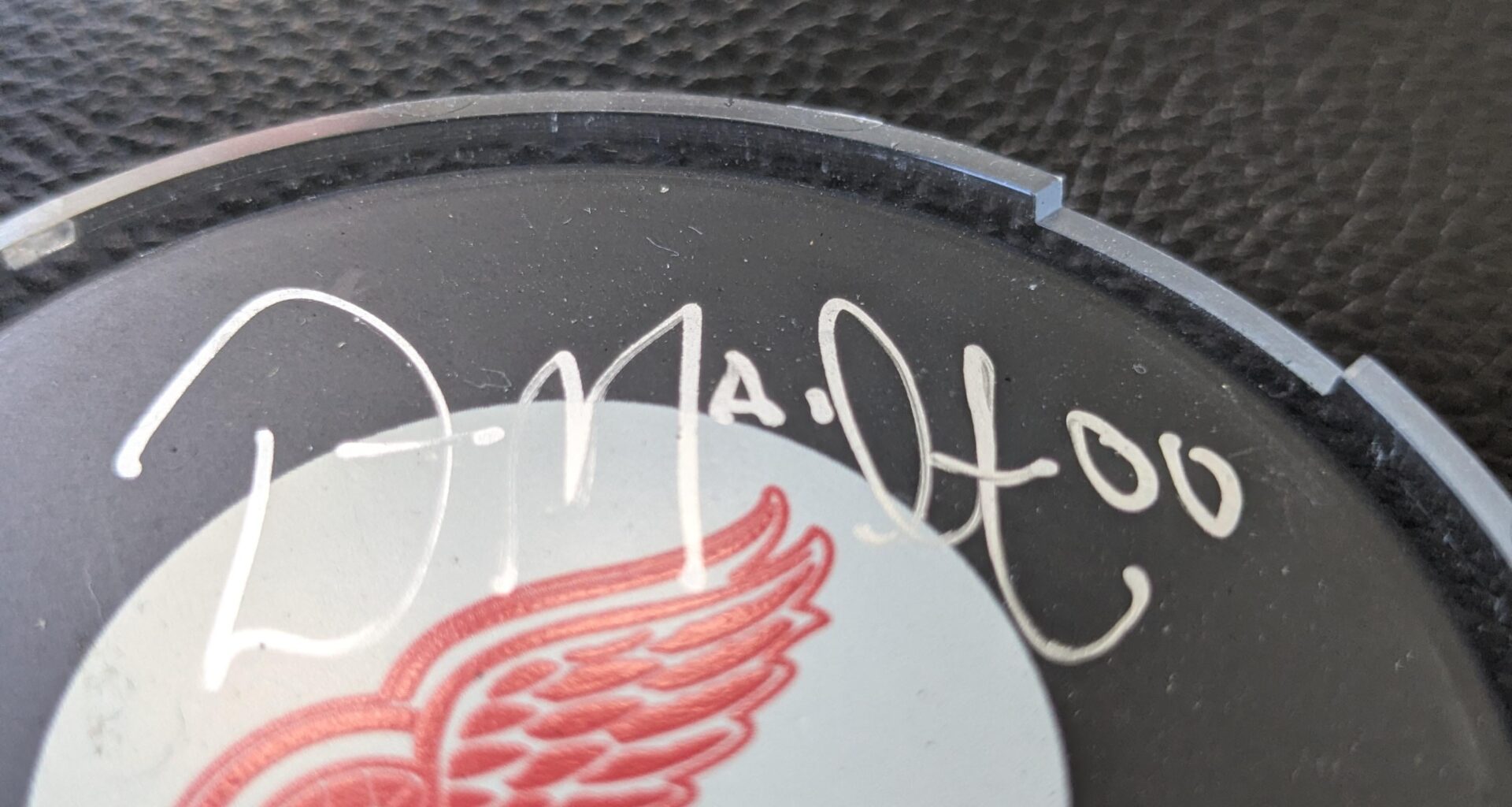 Who the heck signed this puck ??