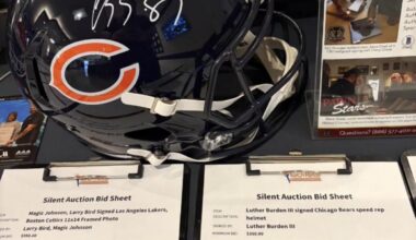 Downtown PHX hotel lobby has an auction for a signed Luther Burden helmet with his training camp #87.