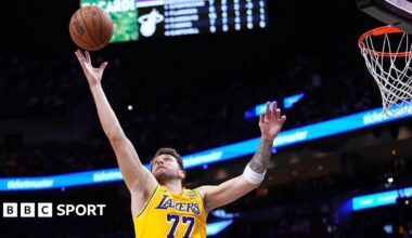 Luka Doncic, Los Angeles Lakers player, collects a rebound against the Miami Heat