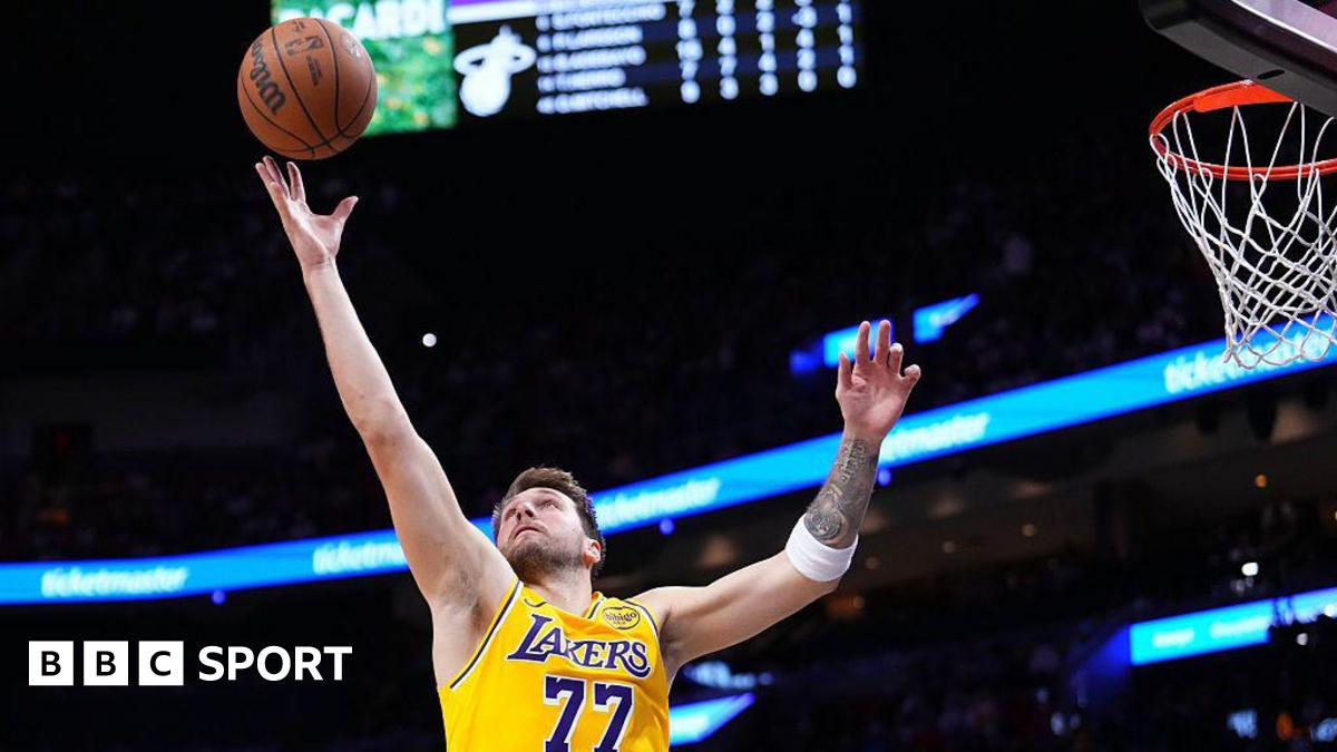 Luka Doncic, Los Angeles Lakers player, collects a rebound against the Miami Heat