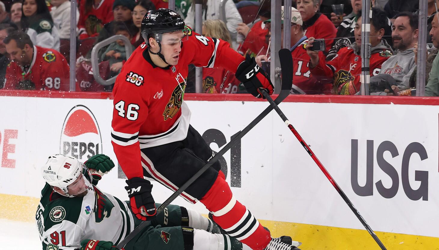 Blackhawks' Louis Crevier lucky to avoid injury after face sliced by skate