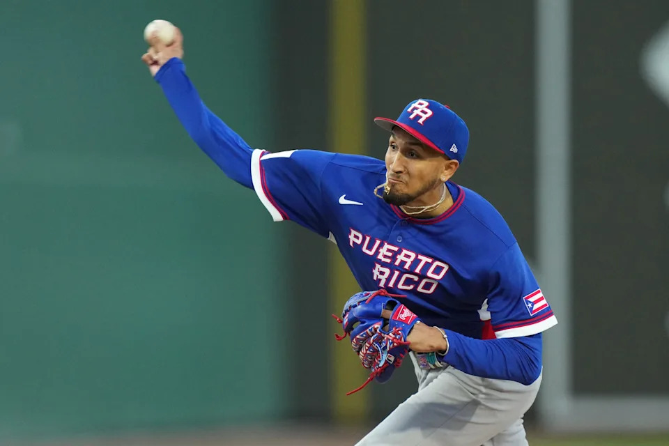 Mar 3, 2026; Lee County, FL, USA; Puerto Rico pitcher Elmer Rodriguez (18) pitches in the first inning against the Boston Red Sox. Mandatory Credit: Jim Rassol-Imagn Images