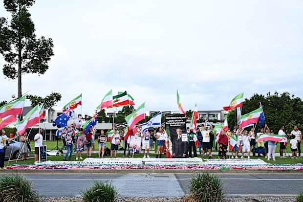 Anti-regime Iran protesters are seen outside the stadium prior to the Women's Asian Cup match.