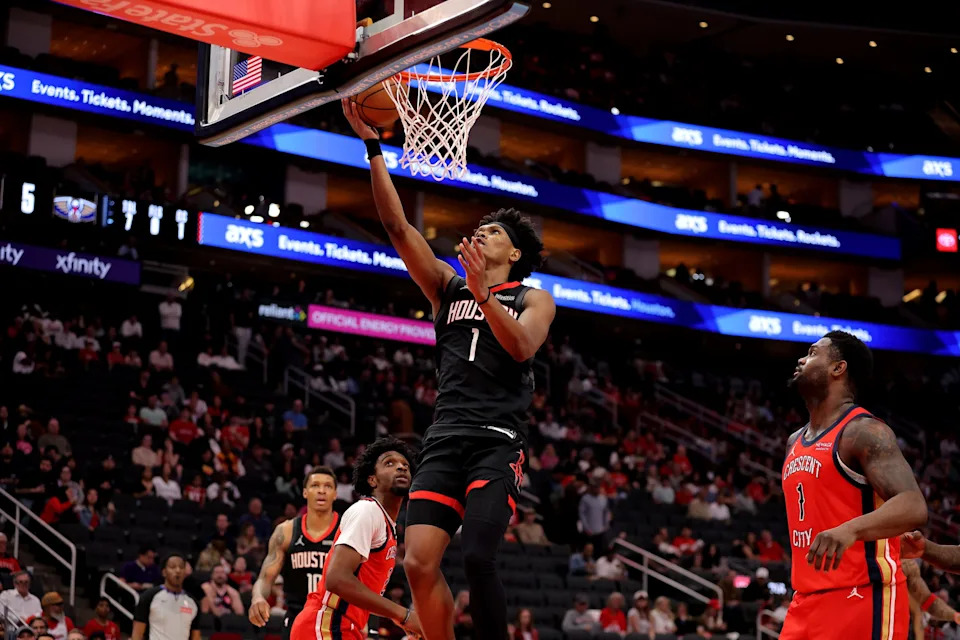 Mar 13, 2026; Houston, Texas, USA; Houston Rockets guard Amen Thompson (1) makes a layup against the New Orleans Pelicans during the first quarter at Toyota Center. Mandatory Credit: Erik Williams-Imagn Images