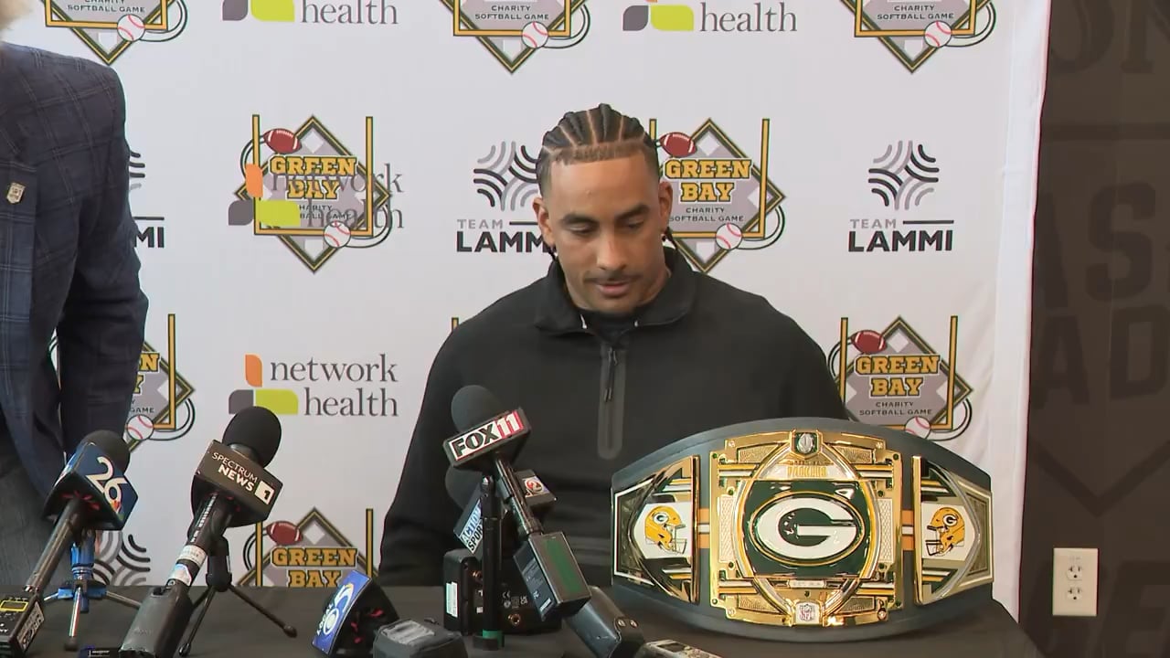 Jordan Love ends his Charity Softball game presser by taking the championship belt and hitting a discount double check
