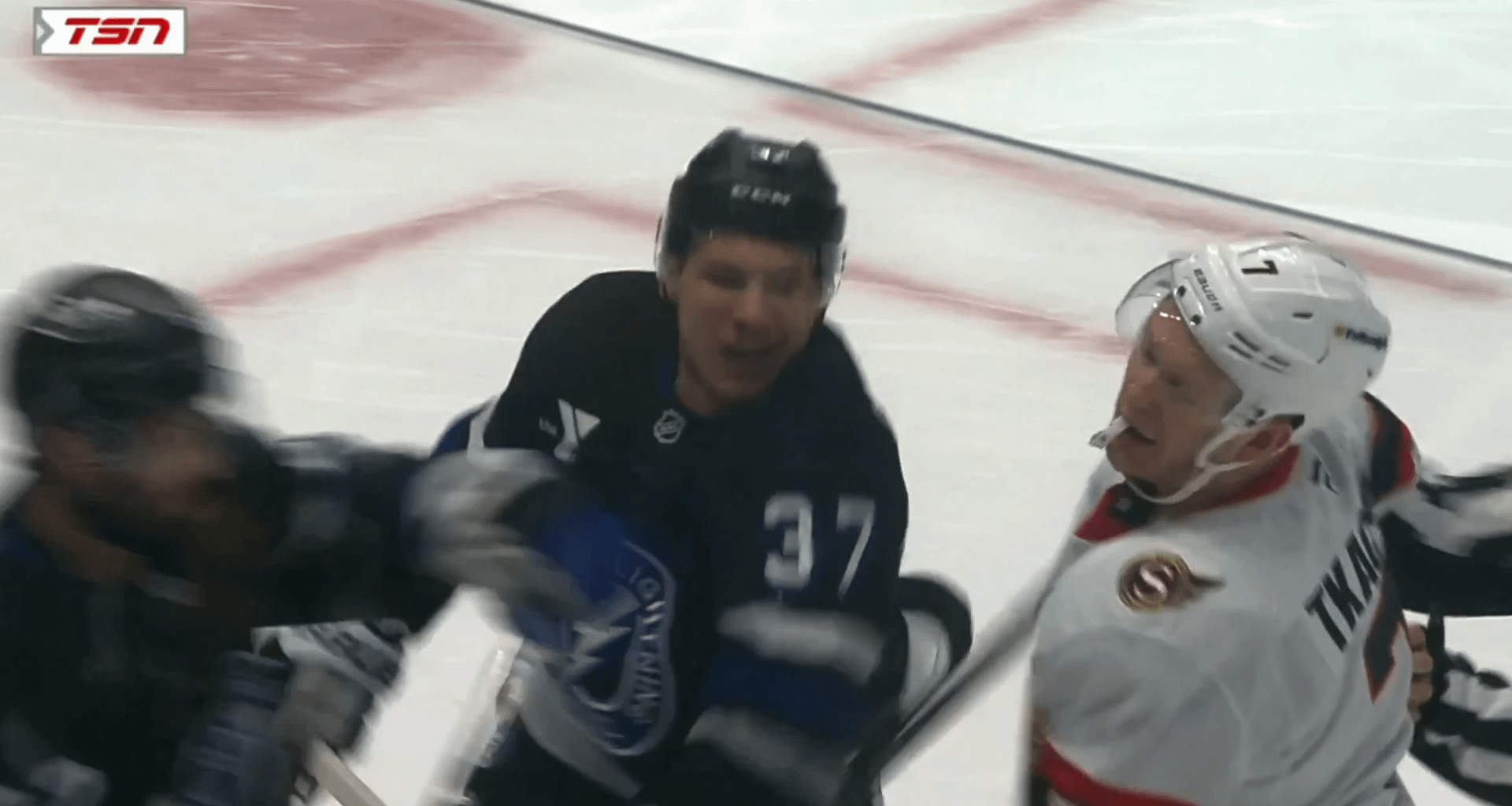 Yanni Gourde slaps Brady Tkachuk after Tkachuk hit him in the back of the head/neck.